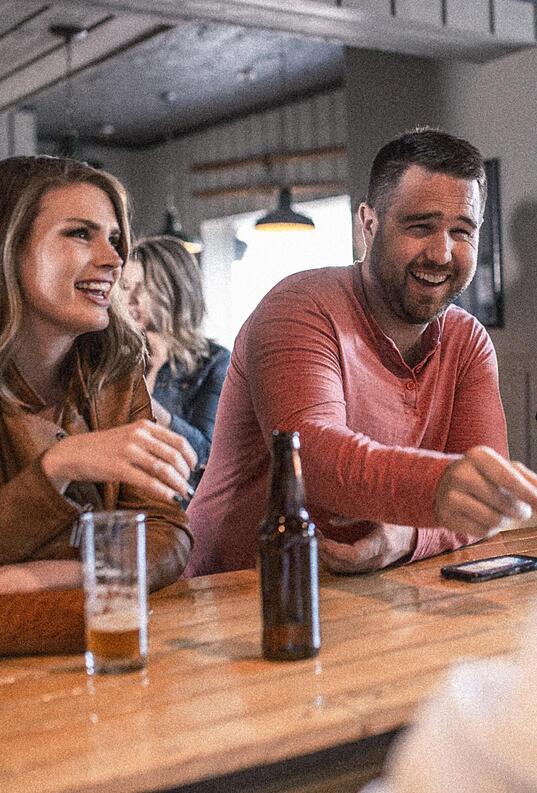 laughing guy and girl at Restore Public House